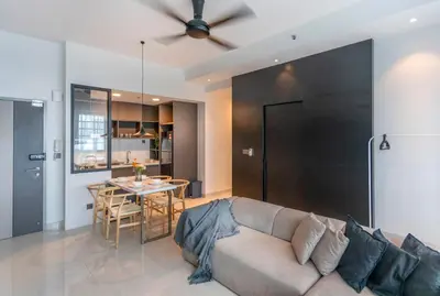 a living room with a couch and a table at Novo Ampang by COBNB near Gleneagles in Kuala Lumpur