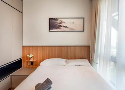 a bedroom with a bed and a window at Novo Ampang by COBNB near Gleneagles in Kuala Lumpur