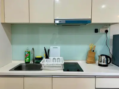 a kitchen with a sink and a counter top with a counter top at 30 OFF Monthly l 4Pax Designer Suite by CITYSPACE in Kuala Lumpur