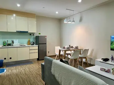 a kitchen and living room with a couch and a table at 30 OFF Monthly l 4Pax Designer Suite by CITYSPACE in Kuala Lumpur