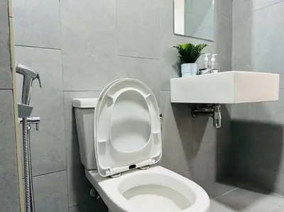 a bathroom with a toilet with the lid up at MVB49#8pax Family Suite 3 Rooms Velocity Mall IKEA in Kuala Lumpur