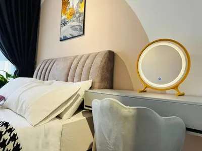 a bedroom with a bed with a mirror and a chair at MVB49#8pax Family Suite 3 Rooms Velocity Mall IKEA in Kuala Lumpur