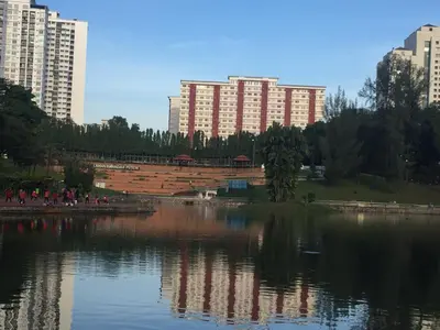 a large body of water in a city with tall buildings at Indah Putri Homestay in Kuala Lumpur