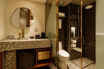a bathroom with a toilet and a sink and a shower at Bintang Collectionz Hotel in Kuala Lumpur
