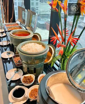a buffet with bowls of food on a table at Bintang Collectionz Hotel in Kuala Lumpur