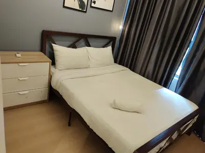 a small bedroom with a bed and a dresser and a window at Arte plus by 3BR sweet home in Kuala Lumpur