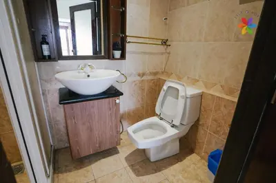 a bathroom with a sink and a toilet at 40P, Bangsar Villa with Pool/Karaoke/Gathering/BBQ in Kuala Lumpur