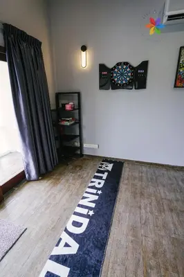 a living room with a rug on the floor at 40P, Bangsar Villa with Pool/Karaoke/Gathering/BBQ in Kuala Lumpur