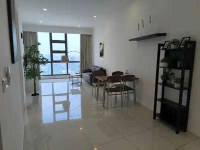 a living room with a table and a dining room at 043 Sweet Home Robertson in Kuala Lumpur
