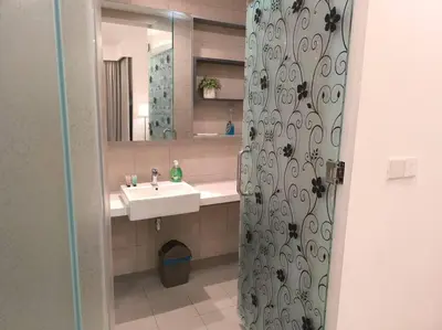 a bathroom with a sink and a mirror at 043 Sweet Home Robertson in Kuala Lumpur