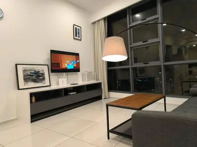 a living room with a tv and a couch and a table at 043 Sweet Home Robertson in Kuala Lumpur