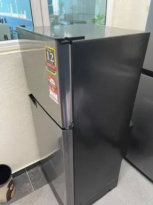 a black refrigerator with stickers on the side of it at SuperMCozy@Setapak Central Mall 10Pax 3BR 2CarPark in Kuala Lumpur