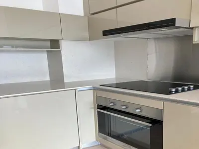 a kitchen with white cabinets and a stove top oven at Luxury Suite Lucentia BBCC Infinity Pool in Kuala Lumpur