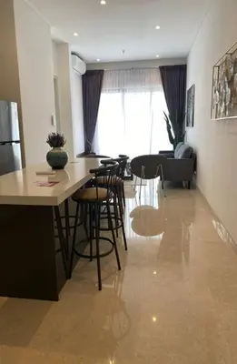 a kitchen and living room with a table and chairs at Luxury Suite Lucentia BBCC Infinity Pool in Kuala Lumpur