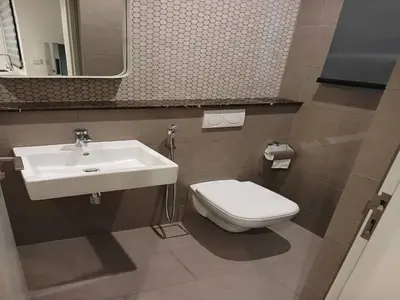 a bathroom with a white sink and a toilet at Luxury Suite Lucentia BBCC Infinity Pool in Kuala Lumpur