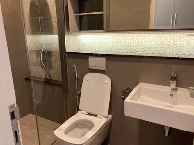 a bathroom with a toilet and a sink at Luxury Suite Lucentia BBCC Infinity Pool in Kuala Lumpur
