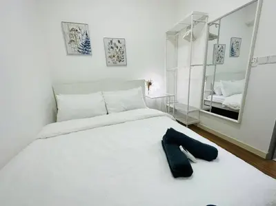 a bedroom with a white bed and a mirror at M Vertica KL City 3B2B 8 Pax [Wi-Fi, 2 Carparks] in Kuala Lumpur