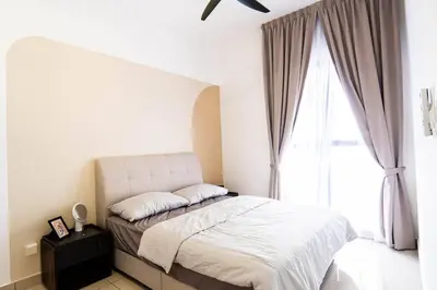 a bedroom with a bed and a large window at Trion @ KL by Airhost in Kuala Lumpur