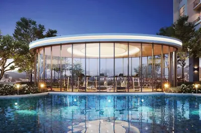 a large building with a pool in front of it at Trion @ KL by Airhost in Kuala Lumpur