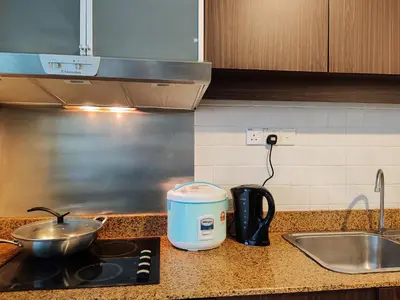 a toaster sitting on a kitchen counter next to a sink at 9 Bukit Bintang 5 minutes to Alor Street Seri Bukit Ceylon 2R2B 8 pax in Kuala Lumpur