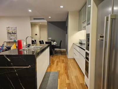 a kitchen with a sink and a counter top at Cosy Apartment at St Mary KL City Centre in Kuala Lumpur