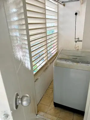 a kitchen with a dishwasher and a window with blinds at VintageHome Lalaport Casa Mutiara Bukit Bintang by Scape Stay in Kuala Lumpur