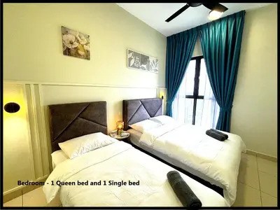 a hotel room with two beds and a window at Skystays360 KL, 60th floor - close to KLCC TRX 2-bedroom 2 bathrooms in Kuala Lumpur