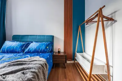 a bedroom with a blue bed with a wooden frame at 10 Mins to KL City - Modern Suite 6 Pax M Vertica in Kuala Lumpur