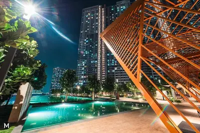 a pool in the middle of a city at night at 10 Mins to KL City - Modern Suite 6 Pax M Vertica in Kuala Lumpur