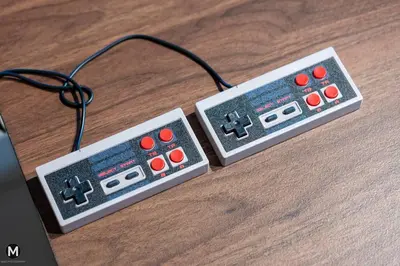a pair of video game controllers sitting on a table at 10 Mins to KL City - Modern Suite 6 Pax M Vertica in Kuala Lumpur
