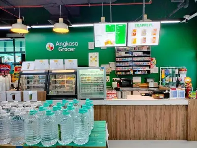 a store with a bunch of water bottles on a counter at Luxe Suites Home KLCC in Kuala Lumpur