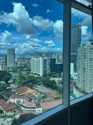 a view of a city from a window at Soho Star Suites near by Klcc in Kuala Lumpur