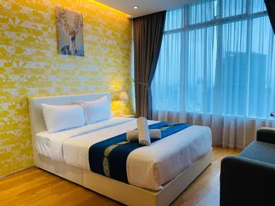 a bedroom with a bed and a large window at Soho Star Suites near by Klcc in Kuala Lumpur