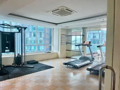 a gym with two exercise bikes in a room at Parkview MALIKA KLCC in Kuala Lumpur