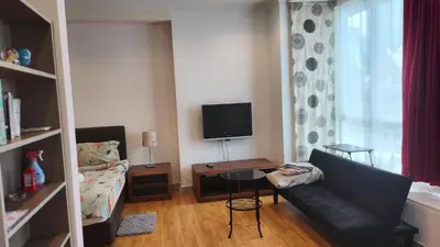 a living room with a couch and a table at Parkview MALIKA KLCC in Kuala Lumpur