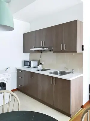 a kitchen with a sink and a microwave at Parkview MALIKA KLCC in Kuala Lumpur