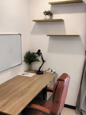 an office with a desk with a lamp and a chair at MH Homestay 3R2B Condo very near to KLCC, Free Wi-Fi, Netflix & Parking in Kuala Lumpur