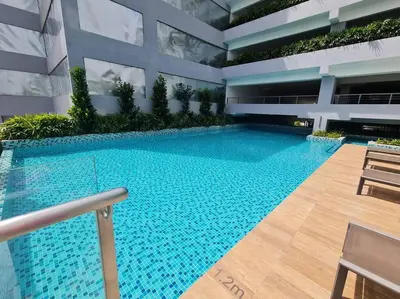 a large swimming pool in the middle of a building at Tiny Studio Suite Near Gleneagles 10 mins to KLCC in Kuala Lumpur