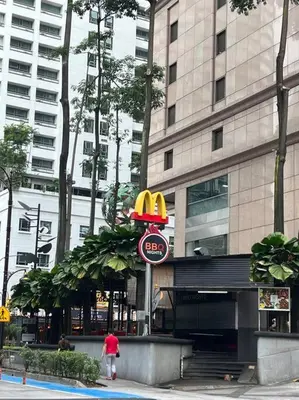 a person walking in front of a mcdonalds restaurant at 450m from Aquaria KLCC/KL ConventionCtre, 2 Beds#2 in Kuala Lumpur