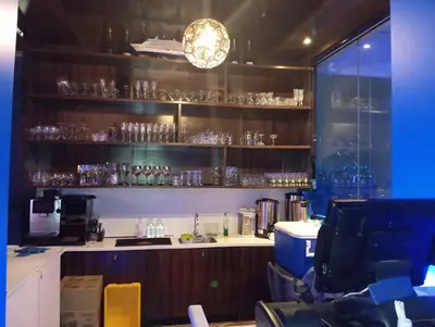 a room with a bar with glasses on the shelves at Platinum suites klcc by Fifty One in Kuala Lumpur