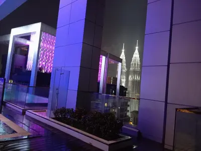a view of the empire state building at night at Platinum suites klcc by Fifty One in Kuala Lumpur