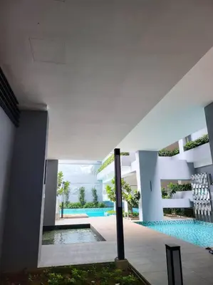 a swimming pool in the middle of a building at Neu Suite Ampang, LRT Jelatek, Gleneagles Hospital in Kuala Lumpur