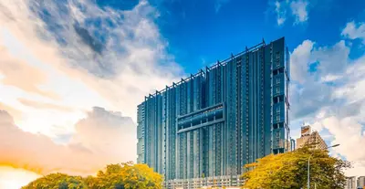 a tall glass building with a sky at M CITY Near KLCC KPJ Puteri Specialist Hospital in Kuala Lumpur