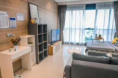 a living room with a couch and a tv at M CITY Near KLCC KPJ Puteri Specialist Hospital in Kuala Lumpur