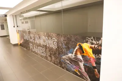 a wall with a painting on it in a hallway at M CITY Near KLCC KPJ Puteri Specialist Hospital in Kuala Lumpur