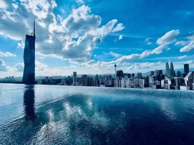 a view of a city from a swimming pool with a city at Maxhome Premium at Lucentia Bukit Bintang City Centre KL in Kuala Lumpur