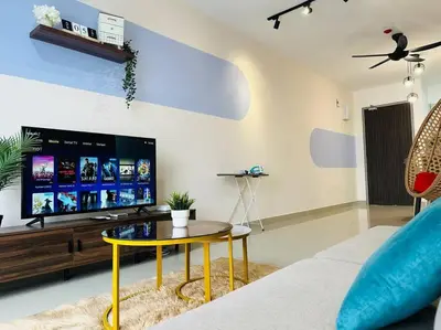a living room with a tv and a table at MVC30#Family Suite 8pax 3 Rooms Sunway Velocity Mall Cheras IKEA Mytown Short Walk to MRT & LRT Maluri in Kuala Lumpur