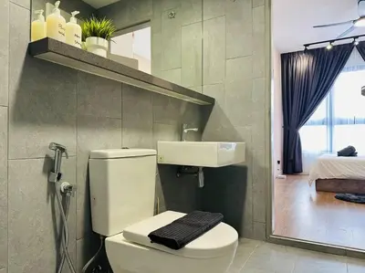 a bathroom with a white toilet and a sink at MVC30#Family Suite 8pax 3 Rooms Sunway Velocity Mall Cheras IKEA Mytown Short Walk to MRT & LRT Maluri in Kuala Lumpur