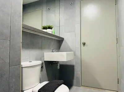 a bathroom with a toilet and a sink and a mirror at MVC30#Family Suite 8pax 3 Rooms Sunway Velocity Mall Cheras IKEA Mytown Short Walk to MRT & LRT Maluri in Kuala Lumpur