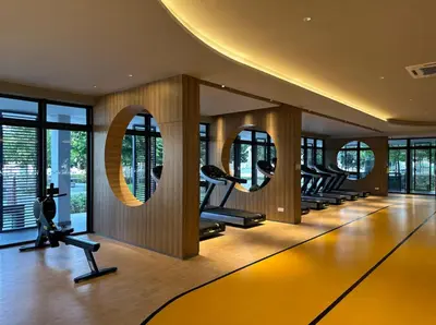 a gym with a row of treadmills and mirrors at MVC30#Family Suite 8pax 3 Rooms Sunway Velocity Mall Cheras IKEA Mytown Short Walk to MRT & LRT Maluri in Kuala Lumpur